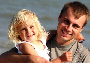 dad and daughter on the beach