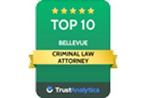 TrustAnalytica Top 10 Criminal Law Attorney award badge for Bellevue with five gold stars and a yell
